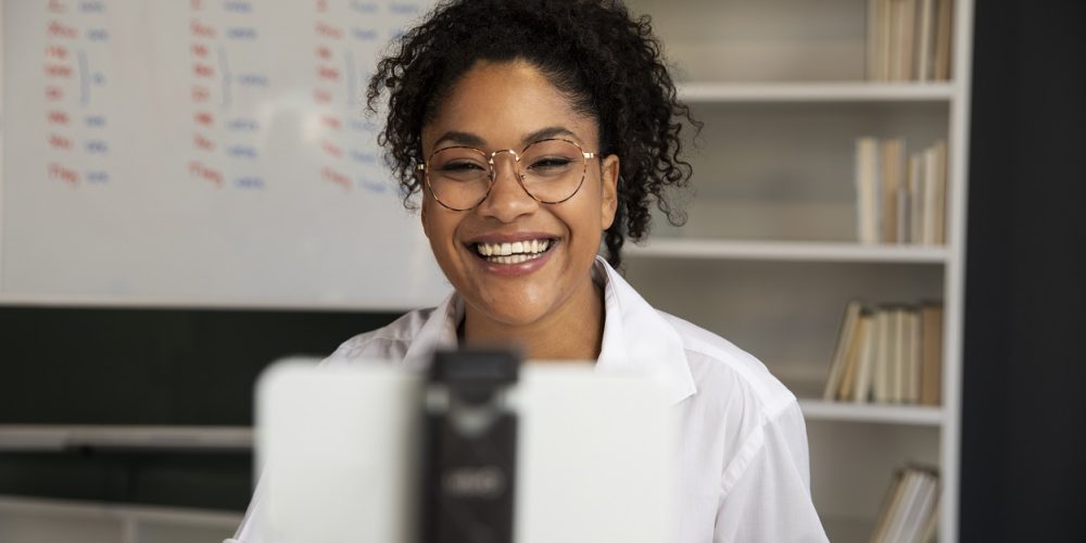 medium-shot-smiley-teacher-recording-herself